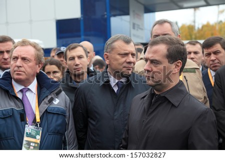 N.TAGIL, RUSSIA - SEP 26: Director plant URAL Victor Korman, Deputy Minister of defense Yuri Borisov and Dmitry Medvedev at the exhibition RUSSIA ARMS EXPO on Sep 26, 2013 at Nizhny Tagil, Russia
