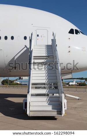 Ladder near the entrance to the  large passenger airliner, nobody