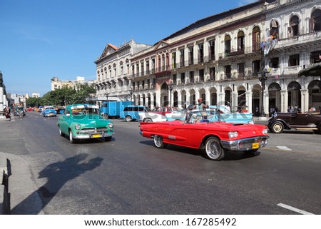 HAVANA - DEC 11: The urban cityscape, old architecture and retro cars on the street on Dec 11, 2012 in Havana, Republic of Cuba
