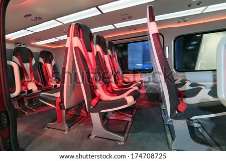 Salon of the modern passenger helicopter with comfortable chairs and seat belt