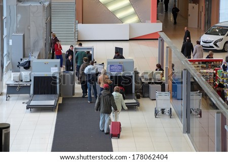 YEKATERINBURG, RUSSIA - SEP 28, 2013: Increased security measures. Screening of passengers at the entrance to the building of the airport Koltsovo