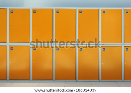 Rows of orange box luggage storage, nobody