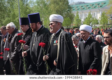 MOSCOW, RUSSIA - MAY 8, 2014: Members of the clergy at the ceremony of laying flowers to the Tomb of the Unknown Soldier in Alexander garden. Festive events dedicated Anniversary of Victory Day