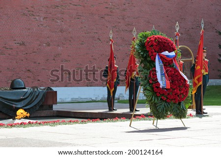 MOSCOW, RUSSIA - MAY 8, 2014: A wreaths and red carnations assigned to the monument Tomb of the Unknown Soldier in Alexander Garden. Festive events dedicated to the 69th Anniversary of Victory Day