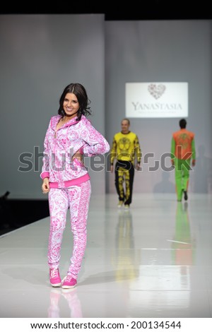 MOSCOW, RUSSIA - APR 1, 2014: Russian fashion designer Anastasia Shevchenko in role models at the show own collection of clothes of trade mark YanaStasia
