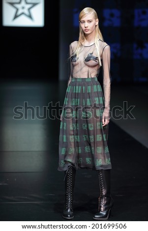 MOSCOW, RUSSIA - APR 03, 2014: Moscow Fashion Week in Gostiny Dvor. Demonstration models of clothes on the catwalk from Moscow designer Masha Tsagal
