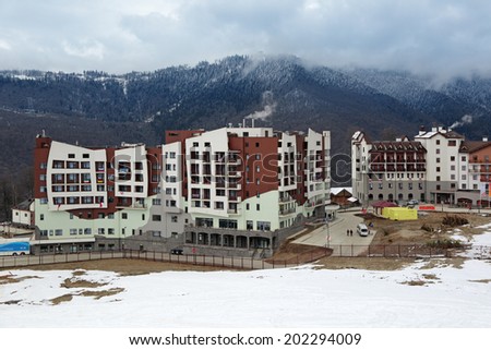 SOCHI, ADLER DISTRICT, KRASNODAR KRAI, RUSSIA - MAR 14, 2014: Mountain Olympic village at Rosa Khutor, Krasnaya Polyana - the place of residence of the athletes of the winter Olympic games 2014