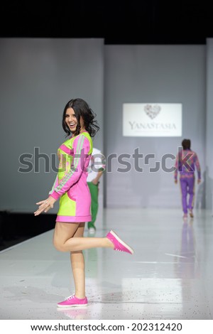 MOSCOW, RUSSIA - APR 1, 2014: Russian fashion designer Anastasia Shevchenko in role models at the show own collection of clothes of trade mark YanaStasia