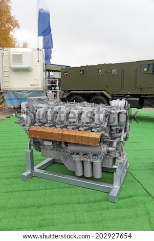 NIZHNY TAGIL, RUSSIA - SEP 25, 2013: The international exhibition of armament, military equipment and ammunition RUSSIA ARMS EXPO (RAE-2013). Diesel engine of high power