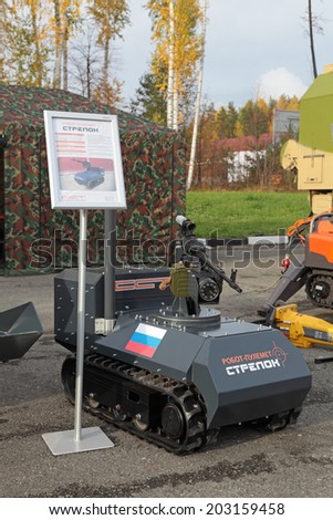 NIZHNY TAGIL, RUSSIA - SEP 26, 2013: The international exhibition of armament, military equipment and ammunition RUSSIA ARMS EXPO (RAE-2013). Remote controlled tracked robot machine gun