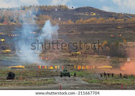NIZHNY TAGIL, RUSSIA - SEP 26, 2013: The international exhibition of armament, military equipment and ammunition RUSSIA ARMS EXPO (RAE-2013). Demonstration of military actions on the firing range