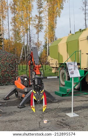 NIZHNY TAGIL, RUSSIA - SEP 26, 2013: The international exhibition of armament, military equipment and ammunition RUSSIA ARMS EXPO (RAE-2013). Multifunctional crawler robot