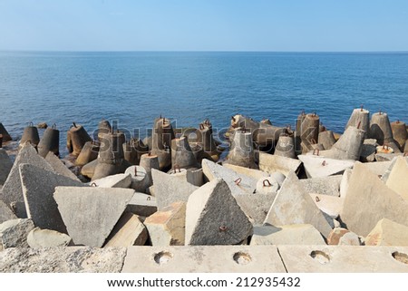 Concrete coastal fortifications on the sea to protect the shore from erosion by waves