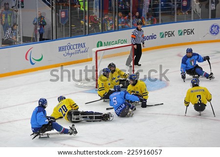 SOCHI, RUSSIA - MAR 12, 2014: Paralympic winter games in ice Arena Shayba. The sledge hockey, match Italy-Sweden. The teams in hockey gate