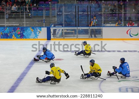 SOCHI, RUSSIA - MAR 12, 2014: Paralympic winter games in ice Arena Shayba. The sledge hockey, match Italy-Sweden