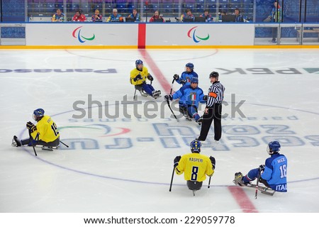 SOCHI, RUSSIA - MAR 12, 2014: Paralympic winter games in ice Arena Shayba. The sledge hockey, match Italy-Sweden