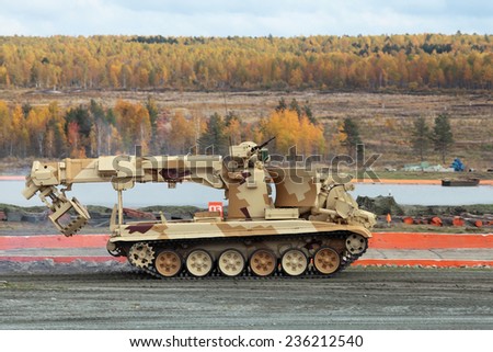 NIZHNY TAGIL, RUSSIA - SEP 26, 2013: The international exhibition of armament, military equipment and ammunition RUSSIA ARMS EXPO (RAE-2013). Engineering machine mouldboard IMR2MA