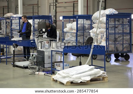 VNUKOVO, MOSCOW REGION, RUSSIA - APR 7, 2015: Russian Post. Logistics center in Vnukovo, employees in the workplace