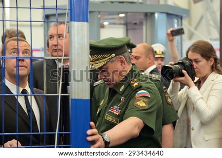 KUBINKA, RUSSIA - JUN 16, 2015: The Prime Minister Dmitry Medvedev, Deputy Prime Minister Dmitry Rogozin and Minister of Defense Sergey Shoygu at the International military-technical forum ARMY-2015