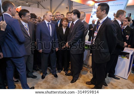ZHUKOVSKY, MOSCOW REGION, RUSSIA - AUG 25, 2015: The President of the Russian Federation Vladimir Vladimirovich Putin with Chinese delegation at the International Aviation and Space salon MAKS-2015