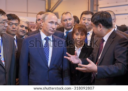 ZHUKOVSKY, MOSCOW REGION, RUSSIA - AUG 25, 2015: The President of the Russian Federation Vladimir Vladimirovich Putin with Chinese delegation at the International Aviation and Space salon MAKS-2015
