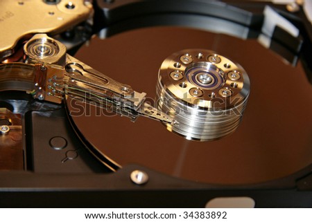 Open HDD of the computer with light patch of light on a disk