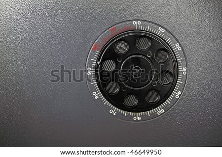 Grey door of the safe with a coded lock