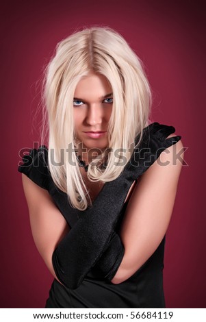 The girl in bad mood on a dark red background