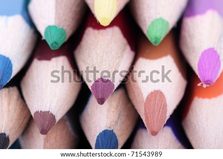 Some color pencils photographed close up from the sharp end