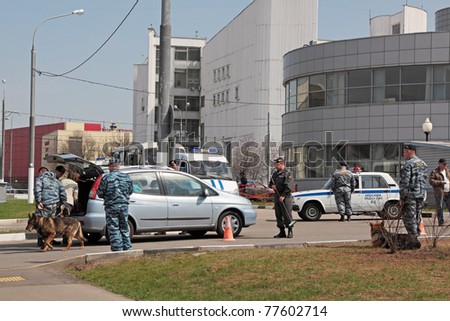 MOSCOW, RUSSIA - APR 30: The police are inspect a car at the entrance to the stadium during 2011 World Championship of Figure Skating on April 30, 2011 in Moscow.