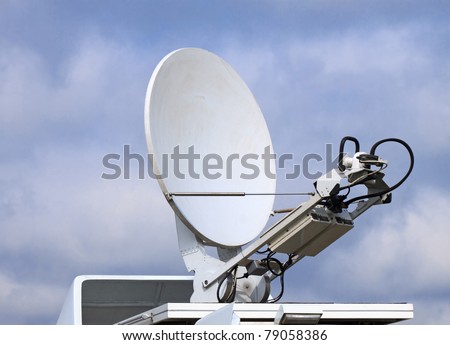 Receiving-transmitting satellite dish on the roof of the vehicle journalists