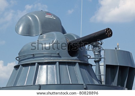 Modern rapid-fire cannon on the deck of a ship of war