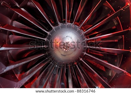 Turbo-jet engine of the plane, close up in the red light