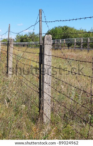 The territory of the fenced fence with barbed wire
