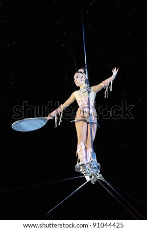 MOSCOW, RUSSIA - NOVEMBER 27: A woman under a dome of a tightrope walker of the Moscow State Circus on November 27, 2011 in Moscow, Russia