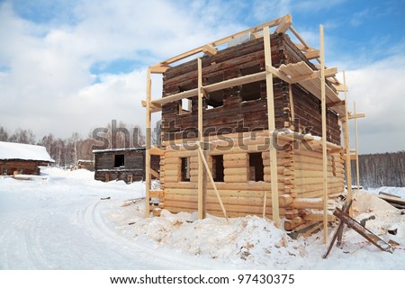 Construction of a wooden house in the rural areas, winter