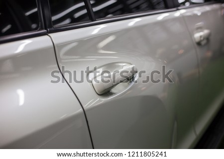 Closeup white Car door handle. Car equipment.selective focus.