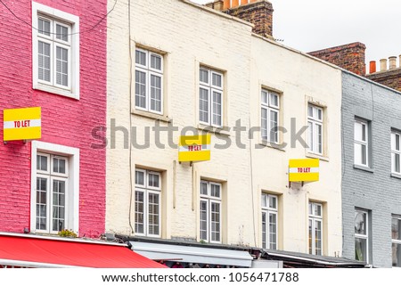 Colourful terraced houses with TO LET signs around Camden Town in London