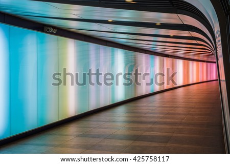 London, UK - May 20, 2016 - King\'s Cross futuristic looking tunnel, the 90 meters long curved pedestrian tunnel features an LED integrated lightwall