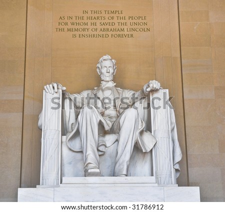 Statue of Abraham Lincoln at the Lincoln Memorial, with inscription.