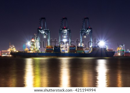 Containers loading by crane in the morning , Trade Port , Shipping