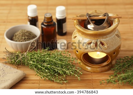 Thyme aromatherapy oil, herbs and chimney