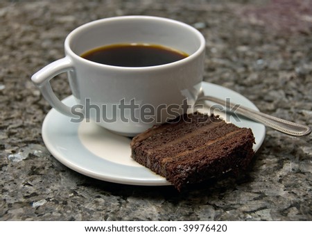 cake and coffee on marbled granite counter top