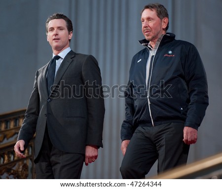 SAN FRANCISCO - FEB 20: SFO Mayor Gavin Newsom (L) walks down City Hall with CEO Larry Ellison to celebrate the return of the America\'s Cup at City Hall on Feb 20, 2010 in San Francisco