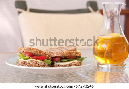 light summer fare with whole wheat sesame sandwiches and iced tea with lemon