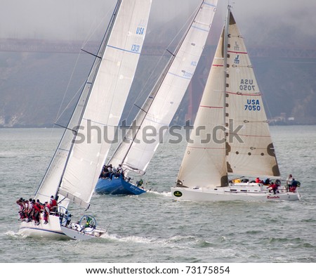 SAN FRANCISCO - SEPT 12: Resolute, a j122, crosses tacks with 2 TP52s at the 45th Rolex Big Boat Series on Sept 12, 2009 in San Francisco Bay, California