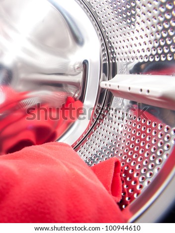 Closeup shot of a washing machine lit from the inside