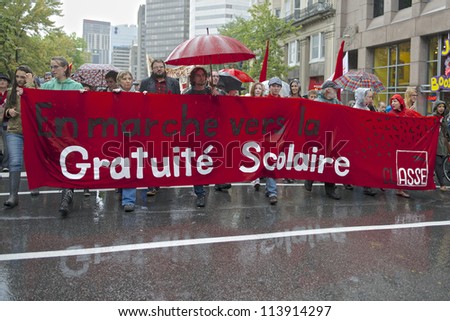 MONTREAL, CANADA - SEPTEMBER 22: Students march behind a banner meaning \