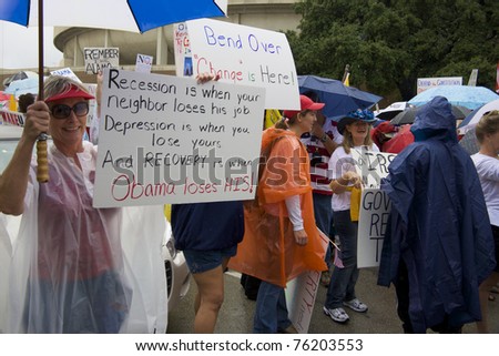 FORT WORTH, TX - SEPTEMBER 12: A group of Tea Party demonstrators prepare for a march on a downtown Fort Worth street on September 12, 2009 in Fort Worth, TX