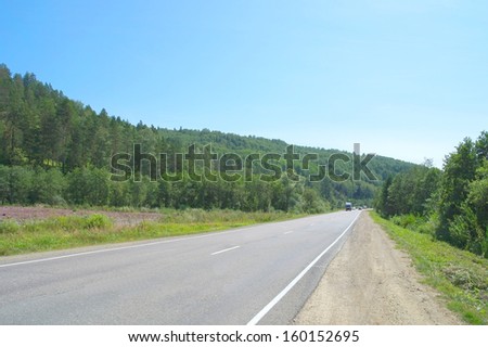 Road through mountains, summer landscape
